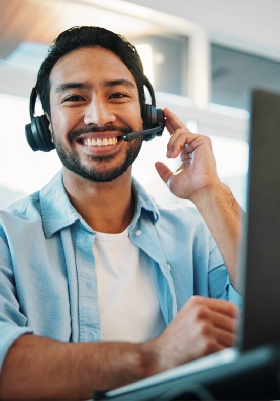 Call center, portrait and man, consultant or business agent speaking on computer for technical support and advice. Happy advisor talk on headphones, laptop and virtual help for information technology.